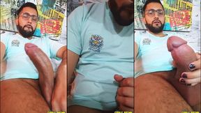 young latin guy with a big uncut cock jerking with spit and precum until he cums