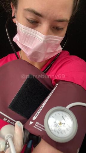 Self BP Cuff Vitals Exam Pink Scrubs Black Stethoscope No Nudity