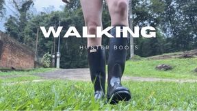 walking hunter boots grass
