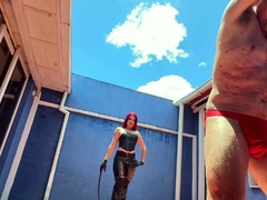 Hot sadistic mistress in leather bullwhips her slave
