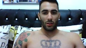 Tatooed Athletic Guy on Couch Storking Cock and Showing