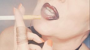 Your goddess Smokerqueenjoan smoking provocatively with many OMI's her Marlboro Red 100