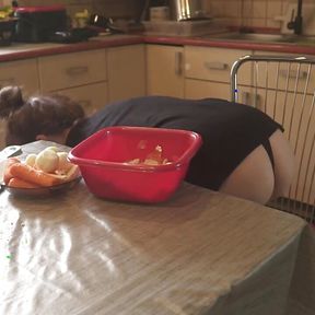 Sexy Dressed Wife Preparing Food in the Kitchen