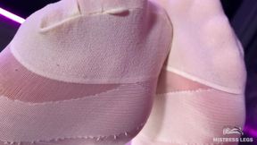 Under the Feet of the Mistress in White Pantyhose on the Bar Counter