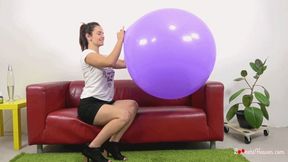 Petra blows up giant purple balloon (FullHD)