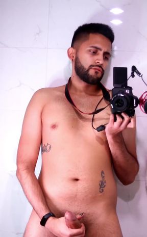 Horny latino stroking his big uncut dick in the mirror until he cums
