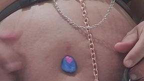 A goth freak girl playin with her belly in bathroom