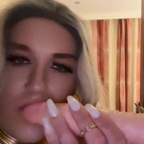 Blonde bimbo in 6 inch heels sucking her dildo