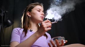 18 Aged Girl Is Smoking Two Strong Cork Cigarettes